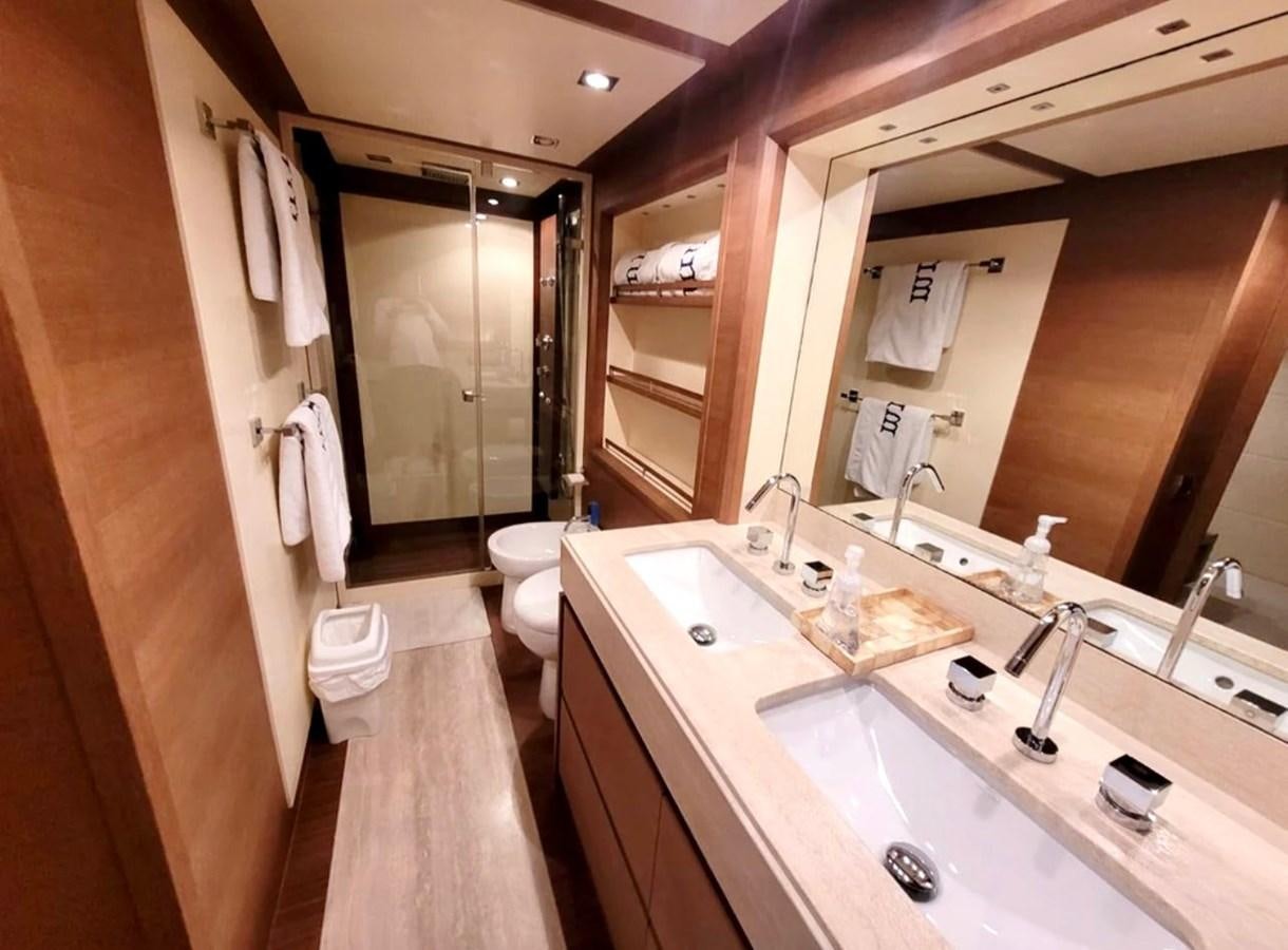 a bathroom with a large mirror aboard M&M Yacht for Sale