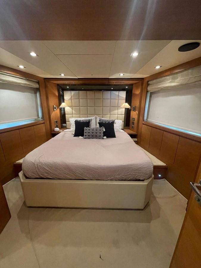 a bed in a room aboard M&M Yacht for Sale