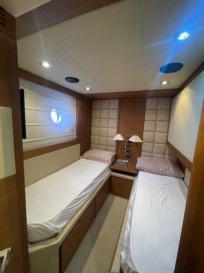 a room with two beds aboard M&M Yacht for Sale