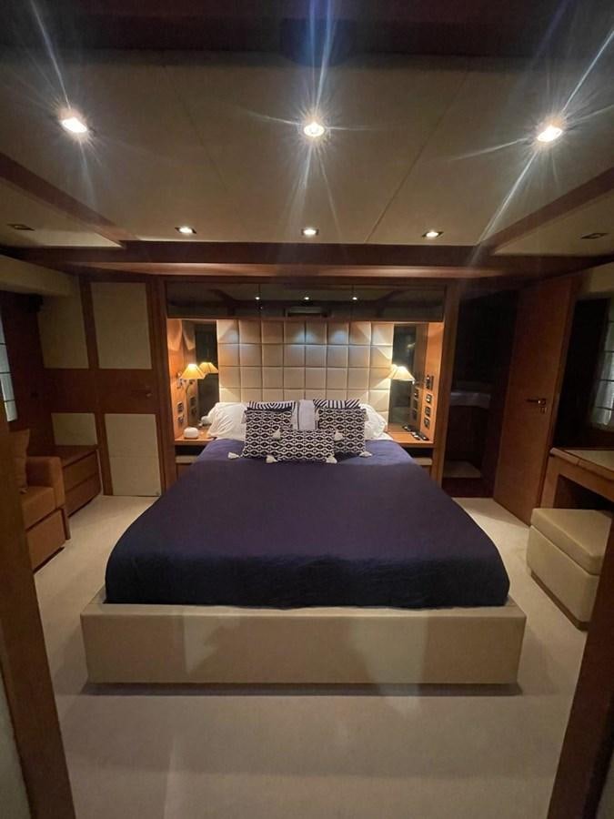 a bed in a room aboard M&M Yacht for Sale