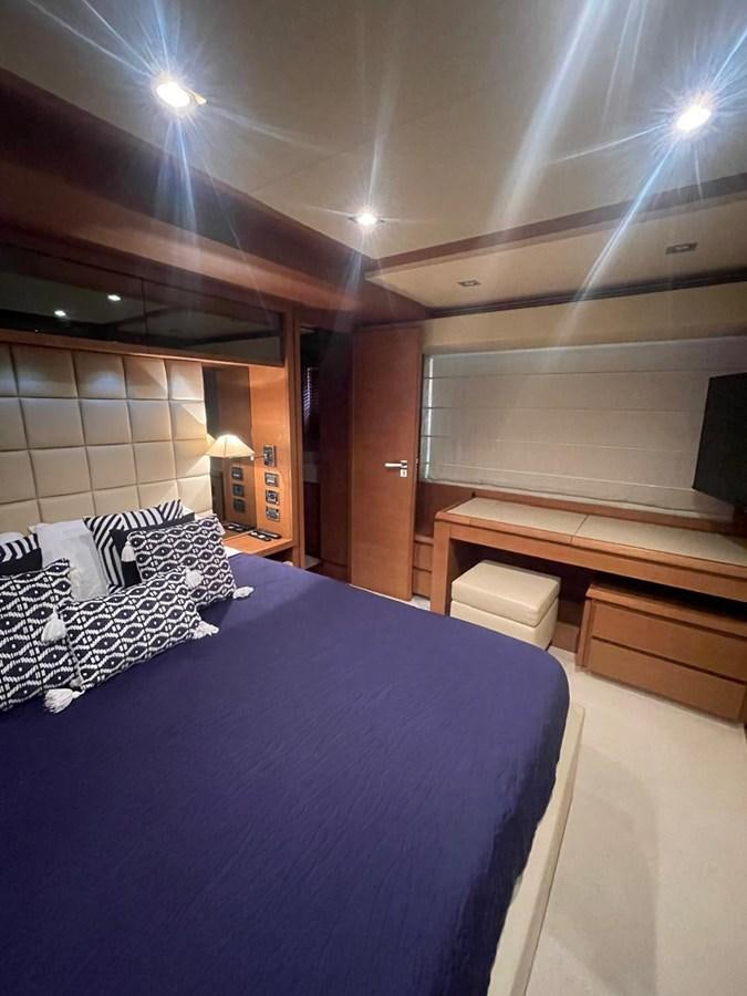 a bed in a room aboard M&M Yacht for Sale