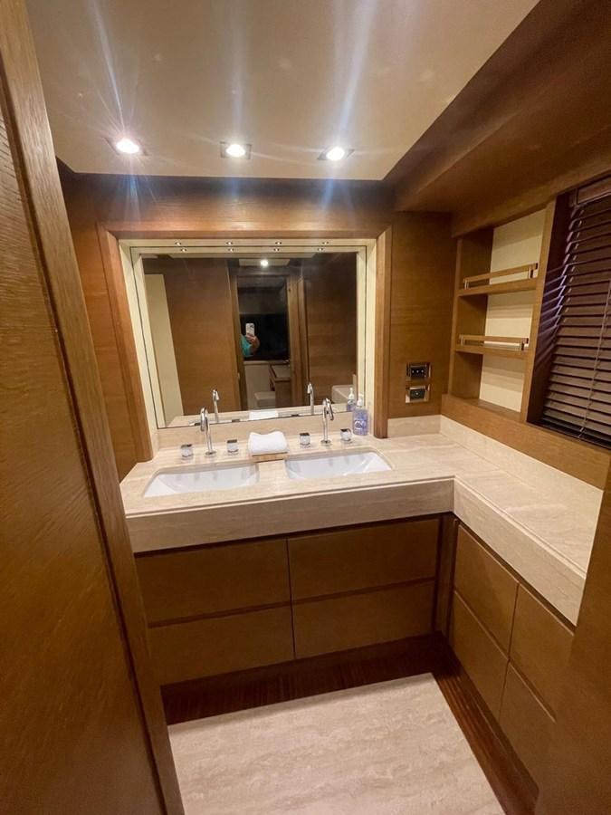 a bathroom with a large mirror aboard M&M Yacht for Sale