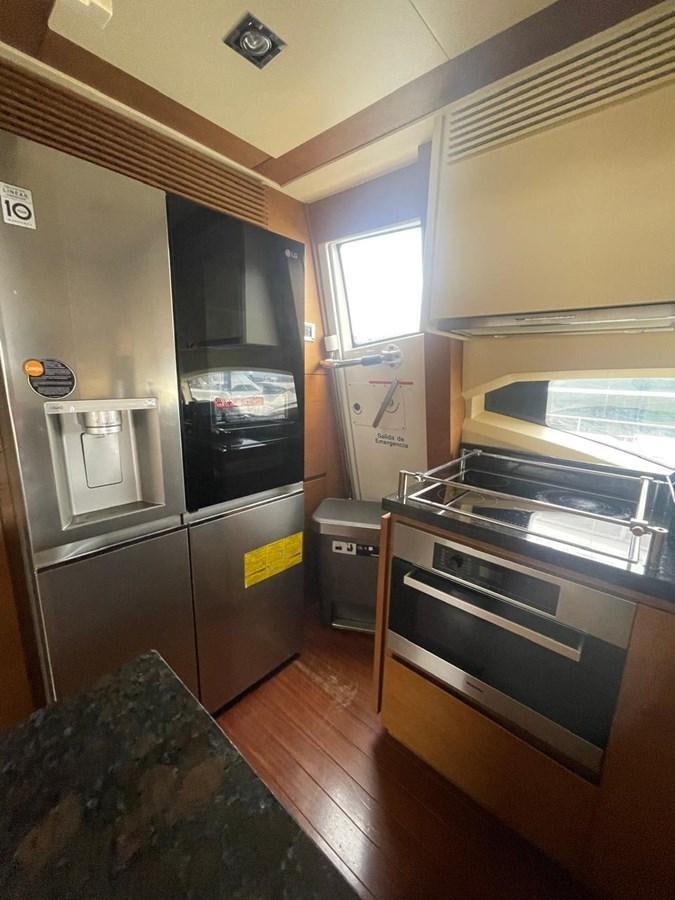 a kitchen with a stove and oven aboard M&M Yacht for Sale