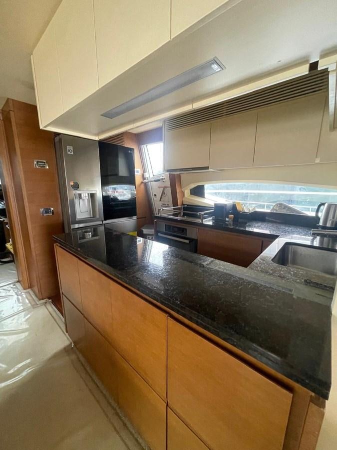 a kitchen with a large island aboard M&M Yacht for Sale