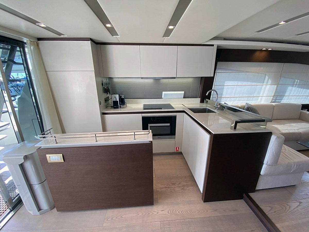 a kitchen with white cabinets aboard MY PRINCESS OF THE SEAS Yacht for Sale
