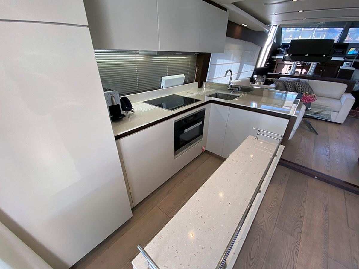 a kitchen with a large island aboard MY PRINCESS OF THE SEAS Yacht for Sale