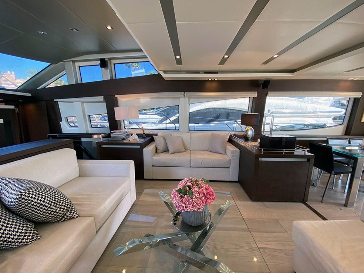 a living room with a large window aboard MY PRINCESS OF THE SEAS Yacht for Sale