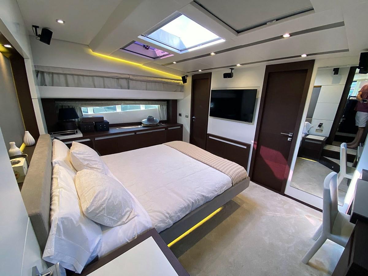 a room with a bed and a desk aboard MY PRINCESS OF THE SEAS Yacht for Sale