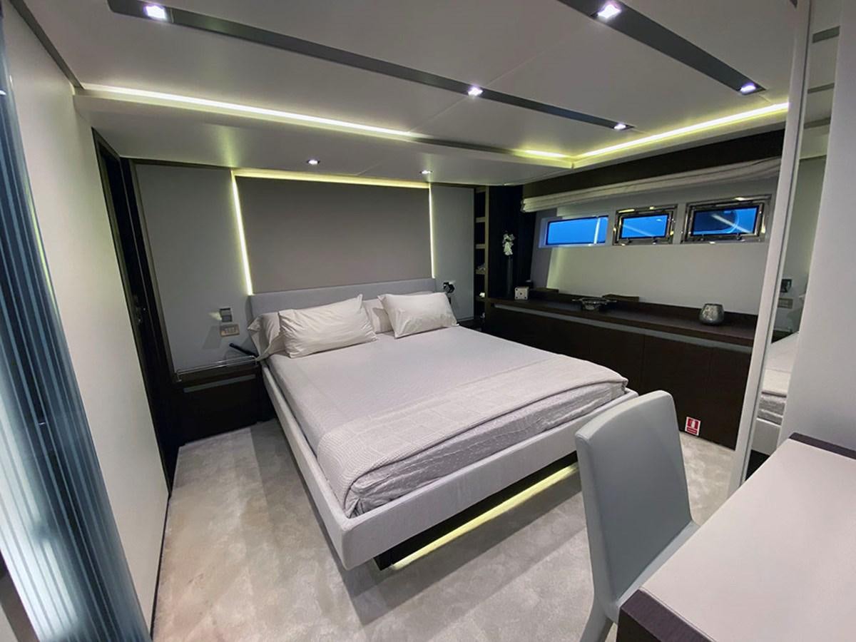 a room with a bed and a desk aboard MY PRINCESS OF THE SEAS Yacht for Sale