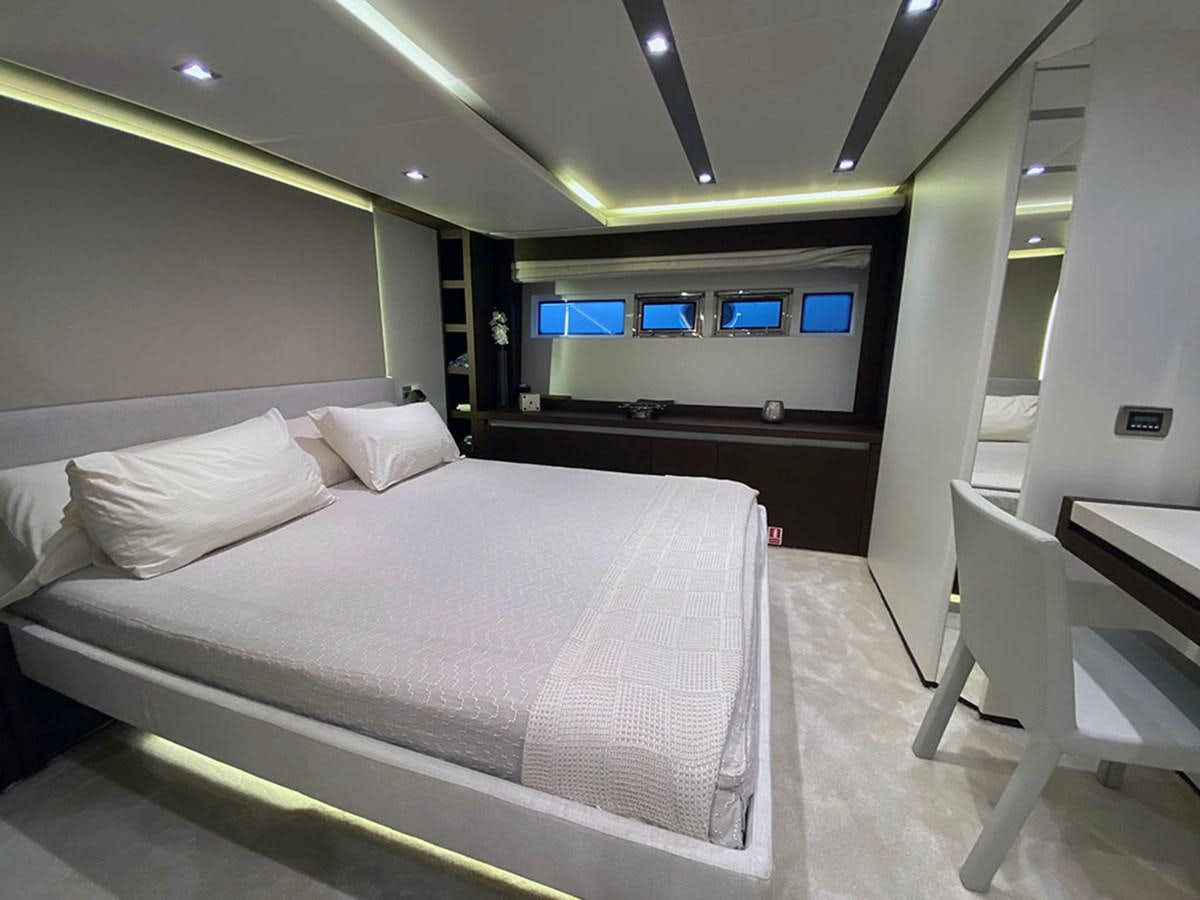 a room with a bed and desk aboard MY PRINCESS OF THE SEAS Yacht for Sale