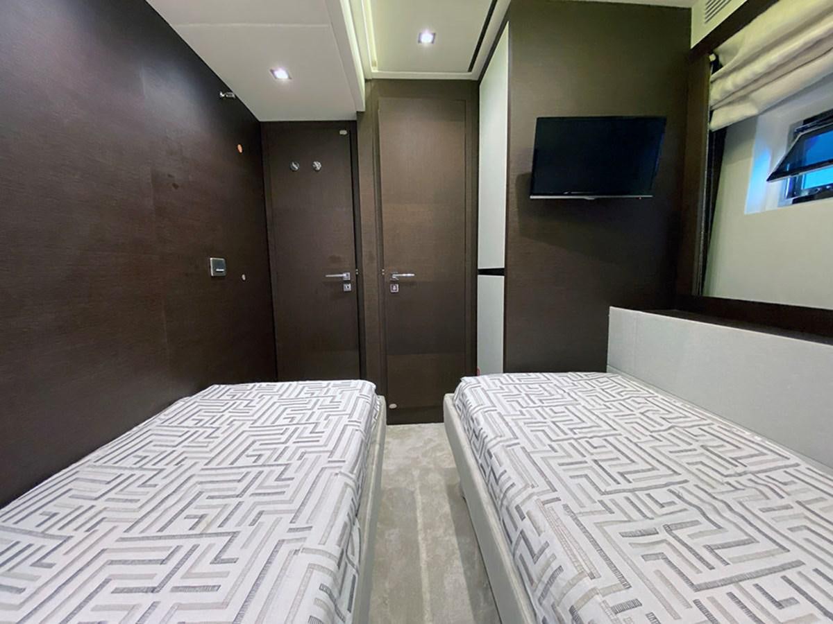 a room with a bed and a table aboard MY PRINCESS OF THE SEAS Yacht for Sale