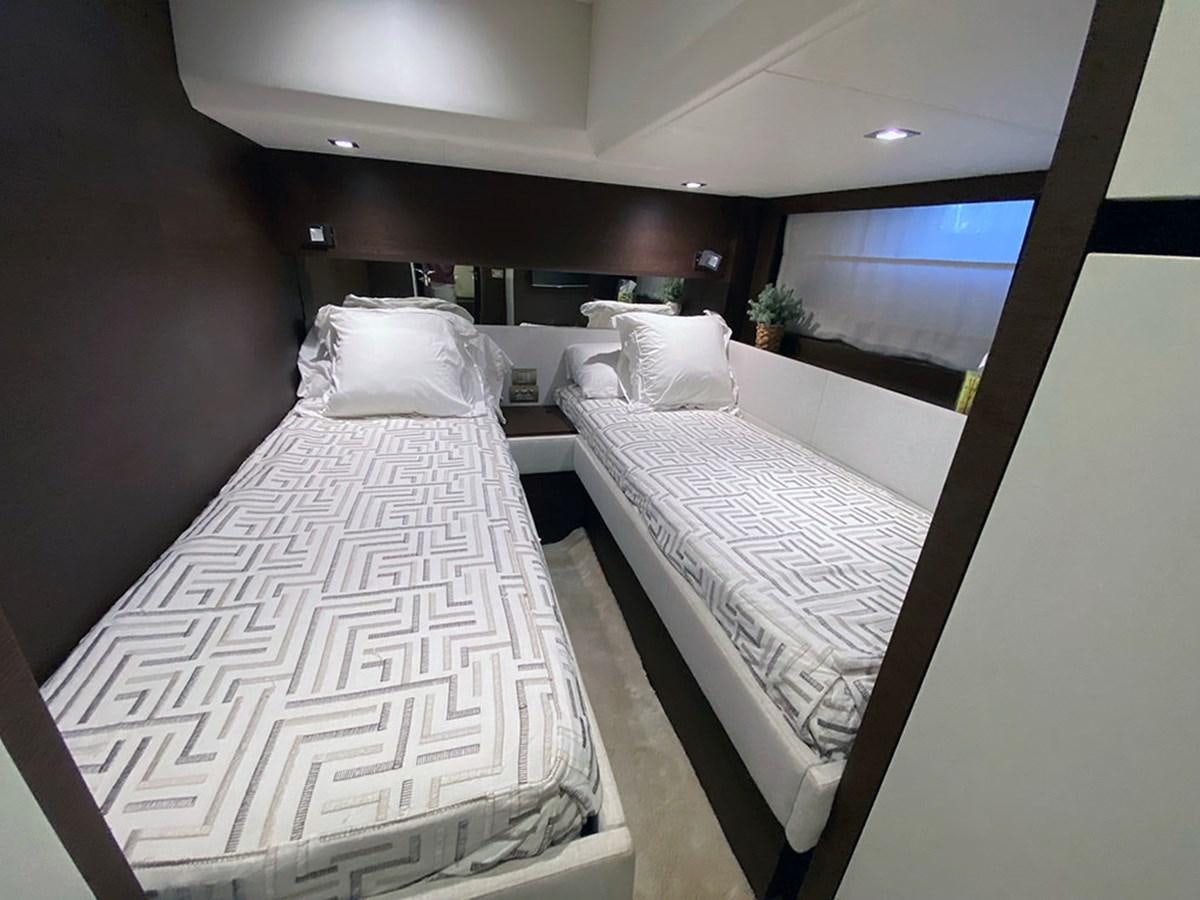 a room with beds and a window aboard MY PRINCESS OF THE SEAS Yacht for Sale