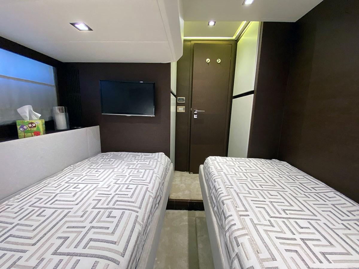 a room with beds and a tv aboard MY PRINCESS OF THE SEAS Yacht for Sale