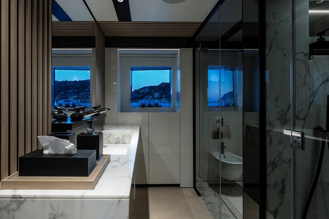 a bathroom with a glass shower aboard ISA GT 45 Yacht for Sale