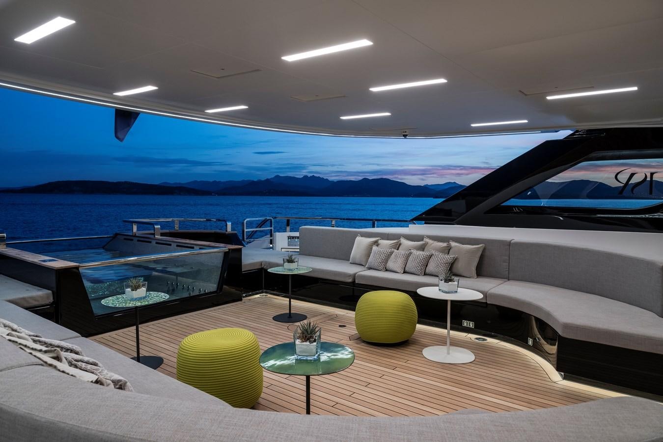 a living room with a couch and a pool aboard ISA GT 45 Yacht for Sale
