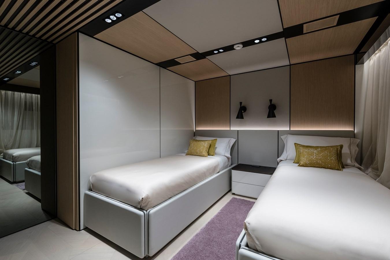 a room with a bed and a purple rug aboard ISA GT 45 Yacht for Sale