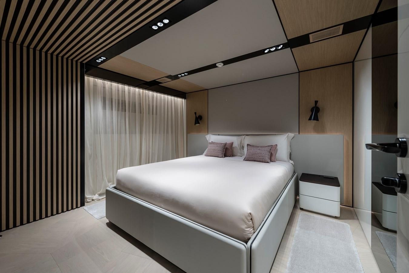 a room with a bed and a desk aboard ISA GT 45 Yacht for Sale