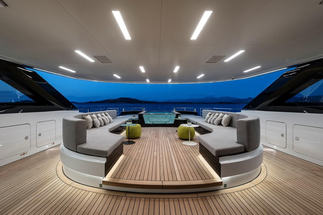 a living room with a large pool aboard ISA GT 45 Yacht for Sale