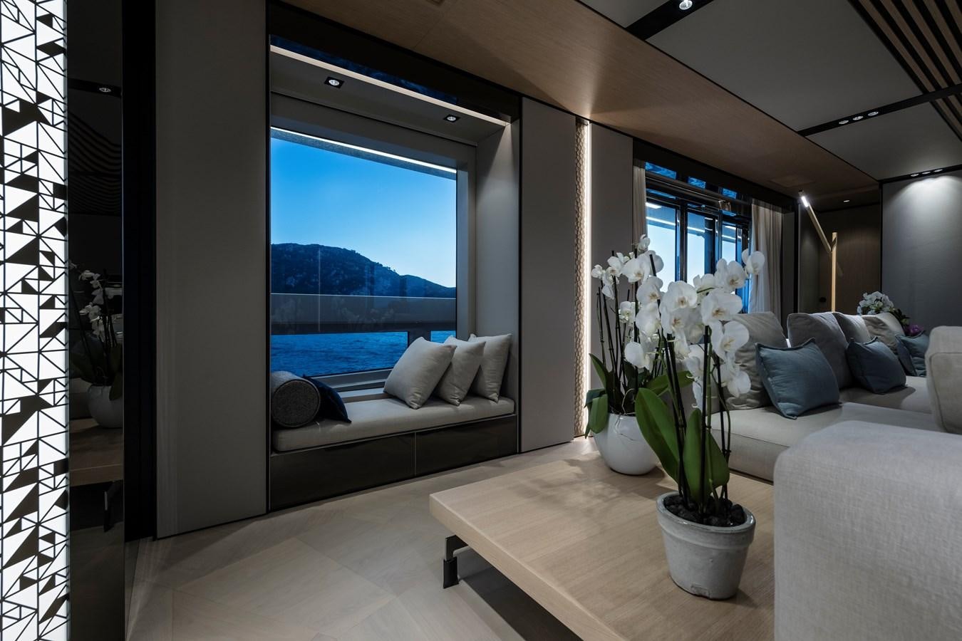 a living room with a large window aboard ISA GT 45 Yacht for Sale