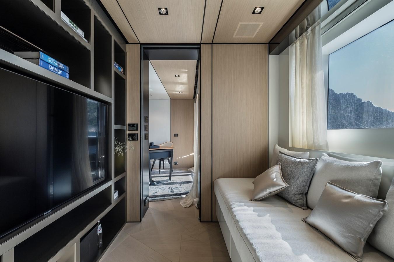 a room with a couch and a tv aboard ISA GT 45 Yacht for Sale