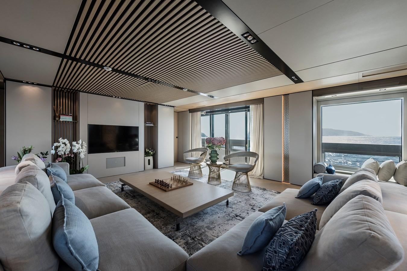 a living room with a large ceiling aboard ISA GT 45 Yacht for Sale