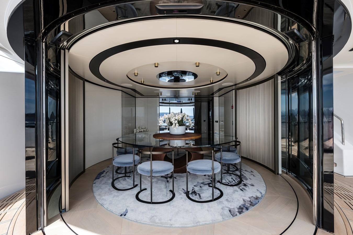 a room with a table and chairs aboard ISA GT 45 Yacht for Sale