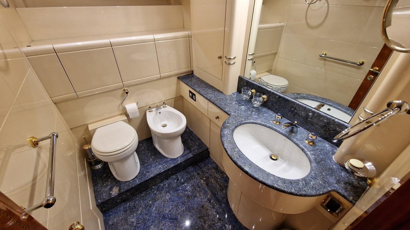 a bathroom with a sink and a toilet aboard BLUE TRINITY Yacht for Sale