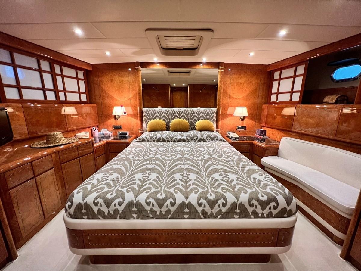 a room with a bed and a desk aboard BLUE TRINITY Yacht for Sale