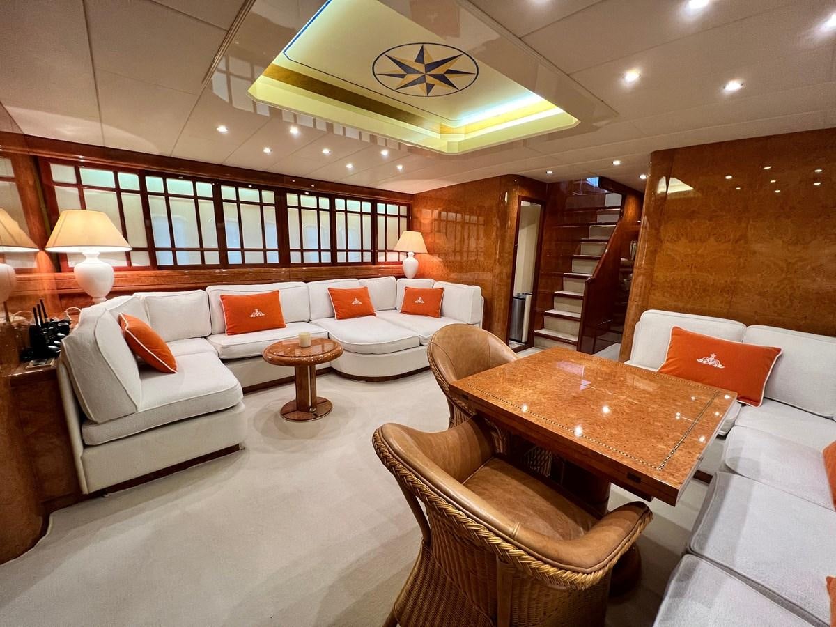a room with a couch and a table aboard BLUE TRINITY Yacht for Sale