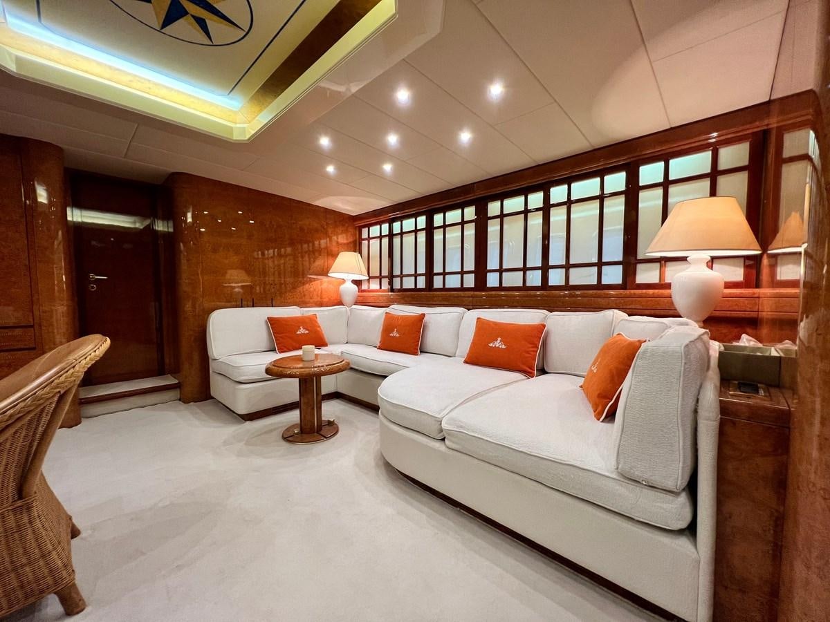 a large room with a bed and a table aboard BLUE TRINITY Yacht for Sale