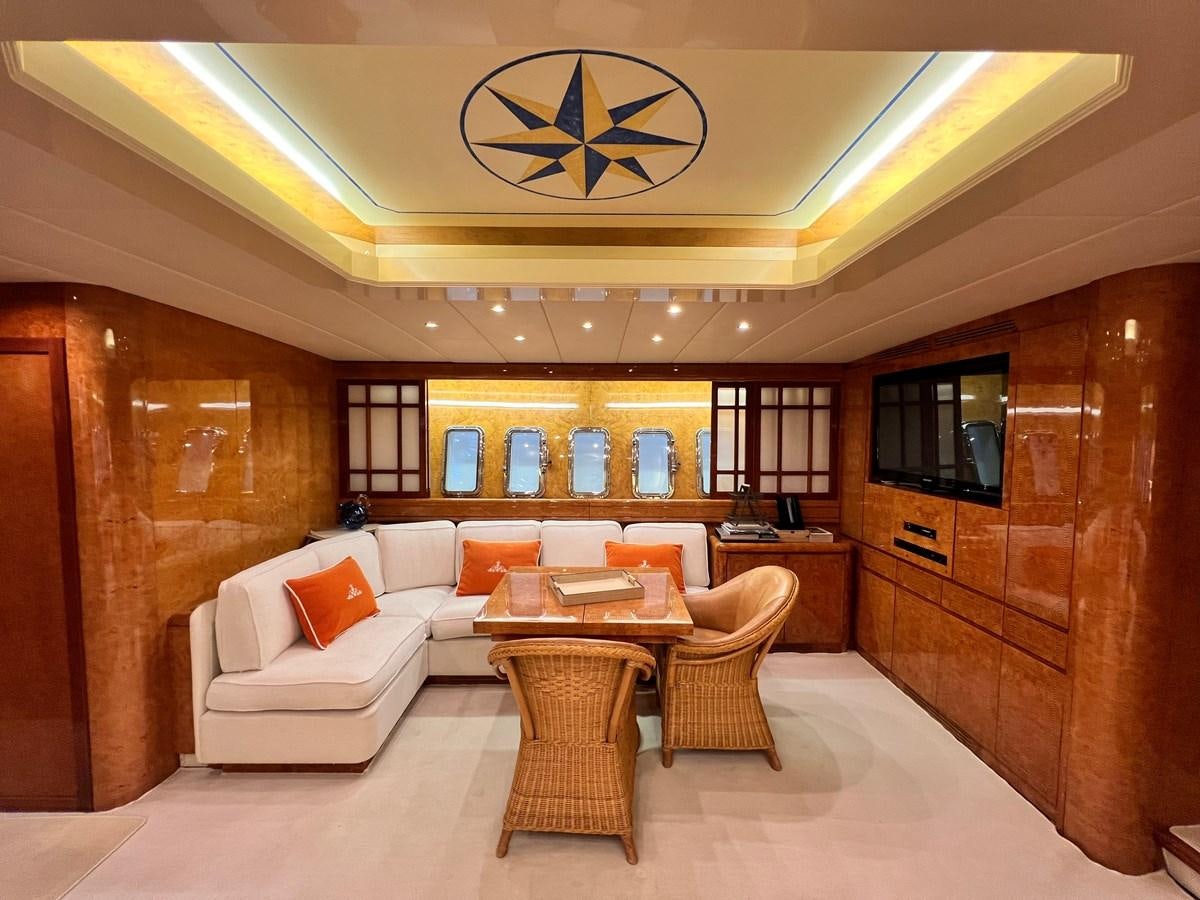 a room with a couch and a table aboard BLUE TRINITY Yacht for Sale