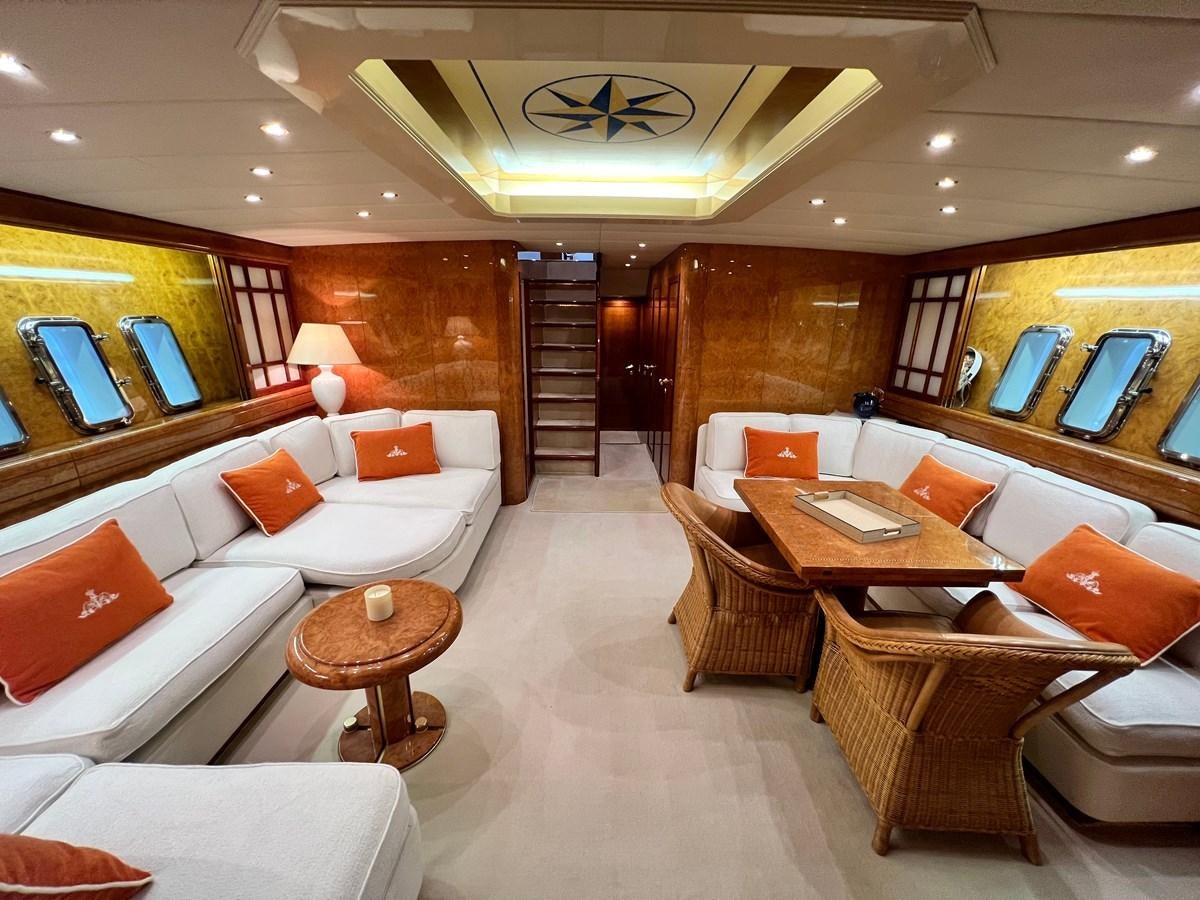 a room with a table chairs and a bed aboard BLUE TRINITY Yacht for Sale
