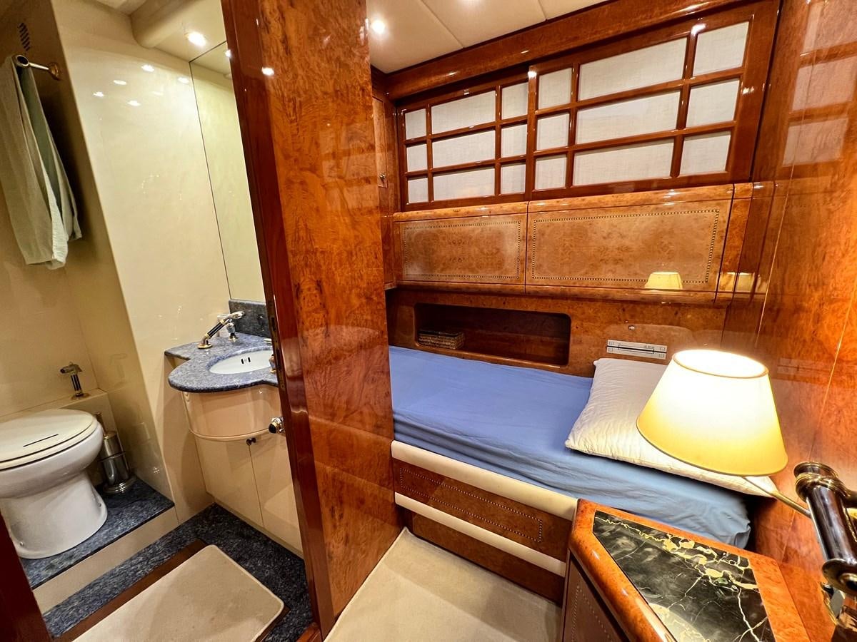 a bathroom with a bed and a sink aboard BLUE TRINITY Yacht for Sale