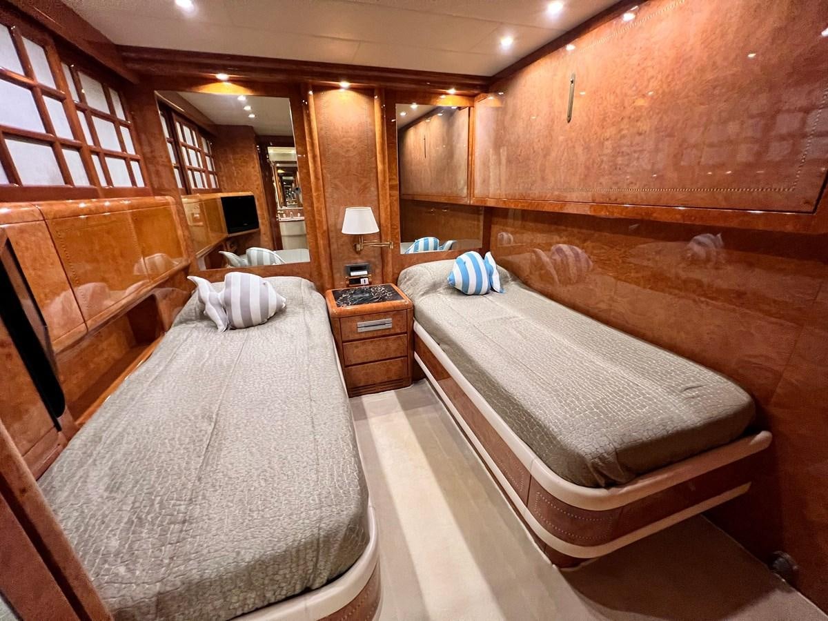 a room with wooden walls and wooden furniture aboard BLUE TRINITY Yacht for Sale