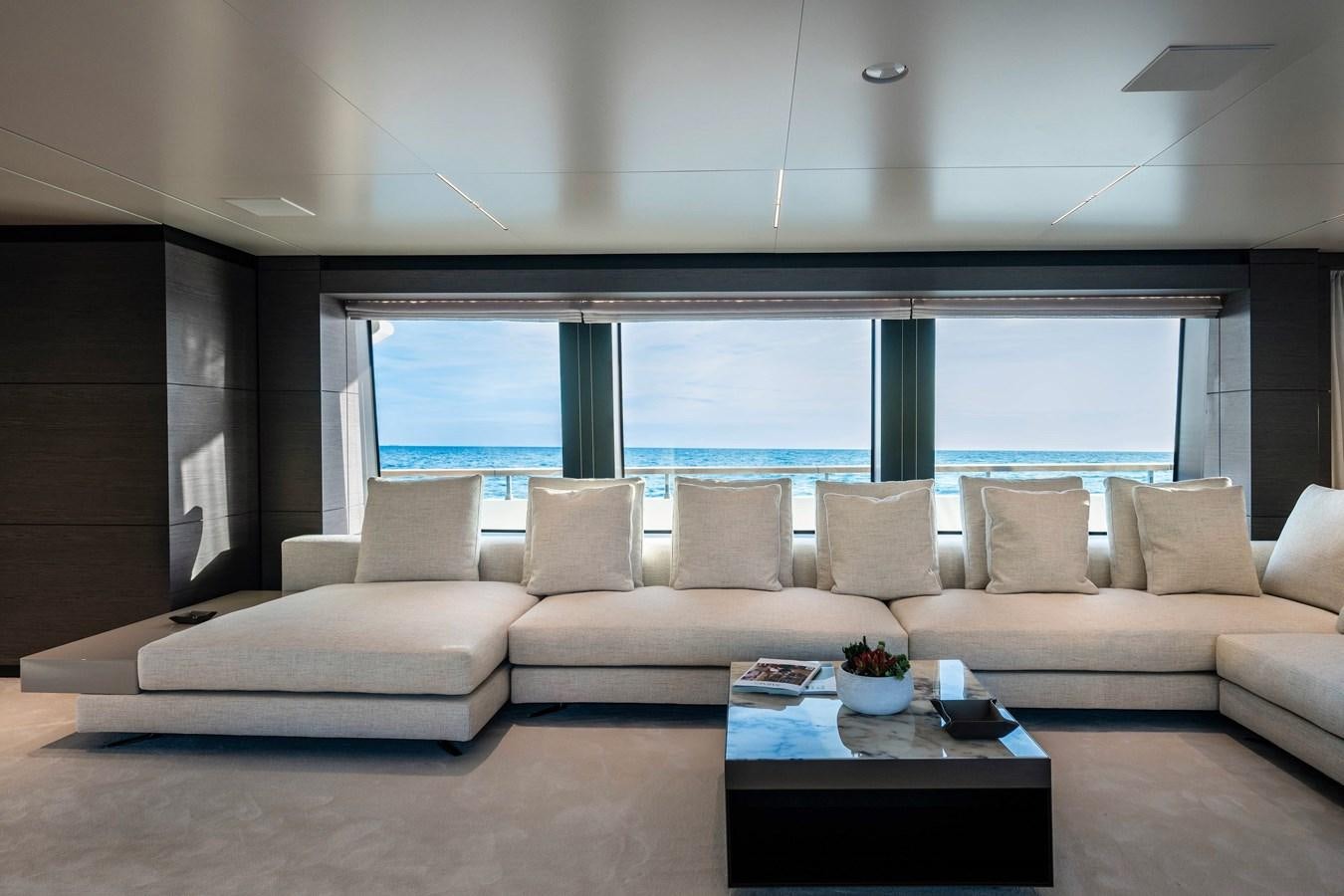 a living room with a large window aboard REGINA Yacht for Sale