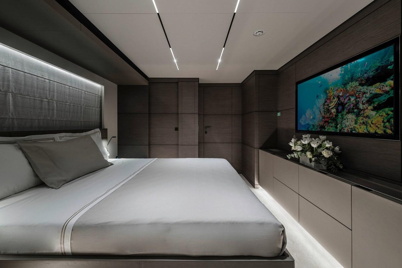a room with a bed and a tv aboard REGINA Yacht for Sale
