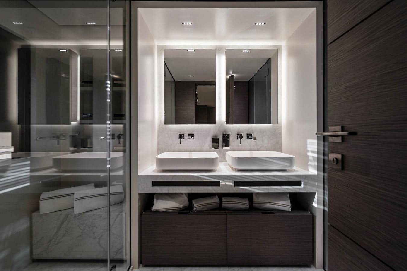 a bathroom with a large mirror aboard REGINA Yacht for Sale