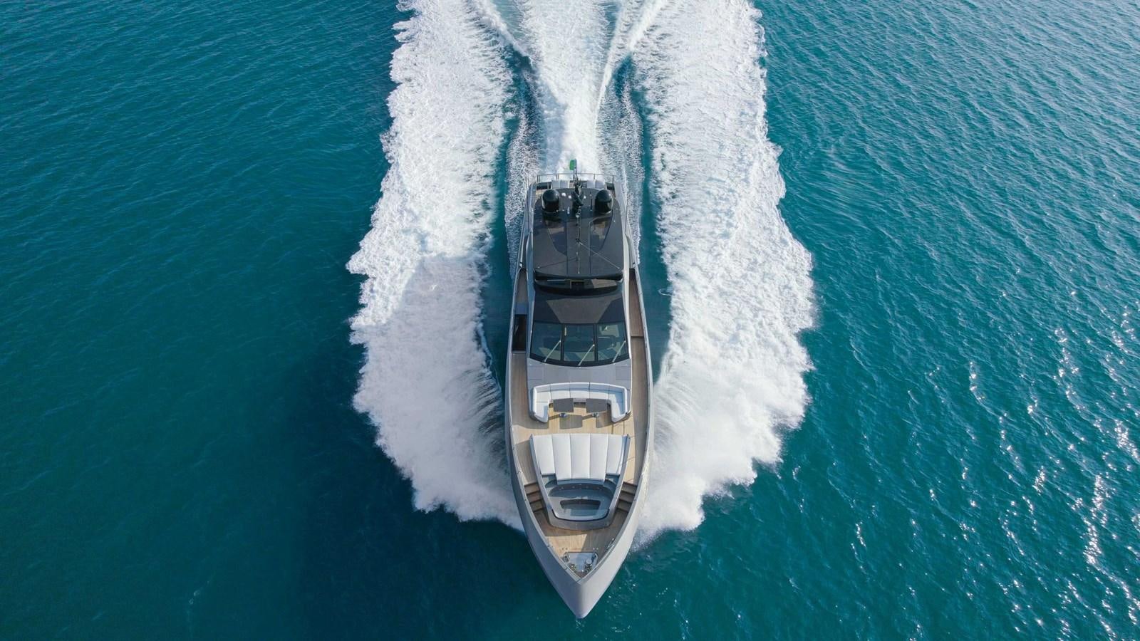 a white car on a road aboard CRAZY TOO Yacht for Sale