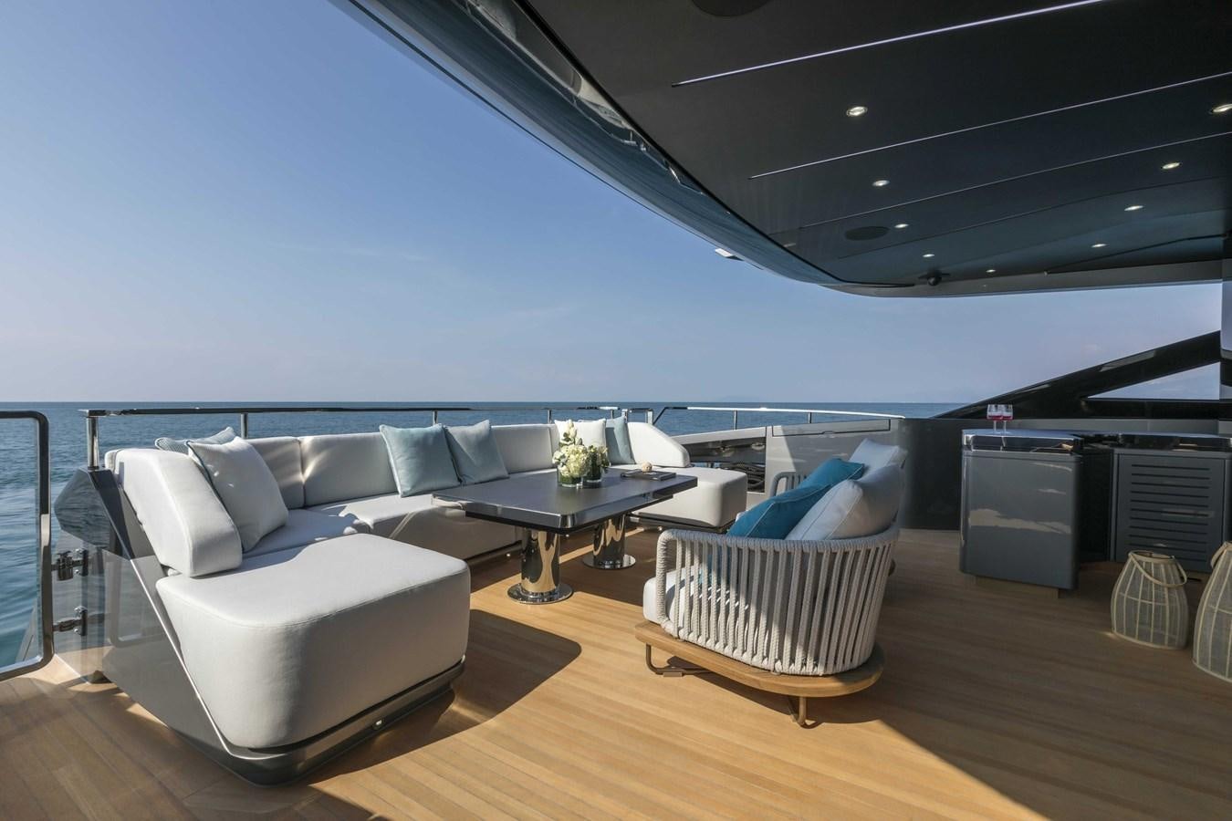 a living room with a couch and a table aboard CRAZY TOO Yacht for Sale