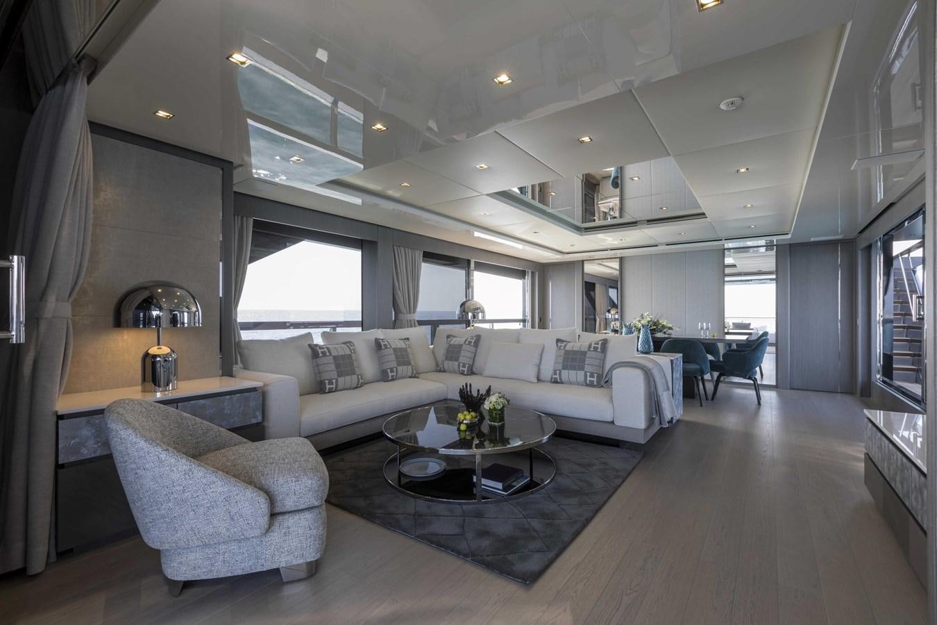 a living room with a large window aboard CRAZY TOO Yacht for Sale