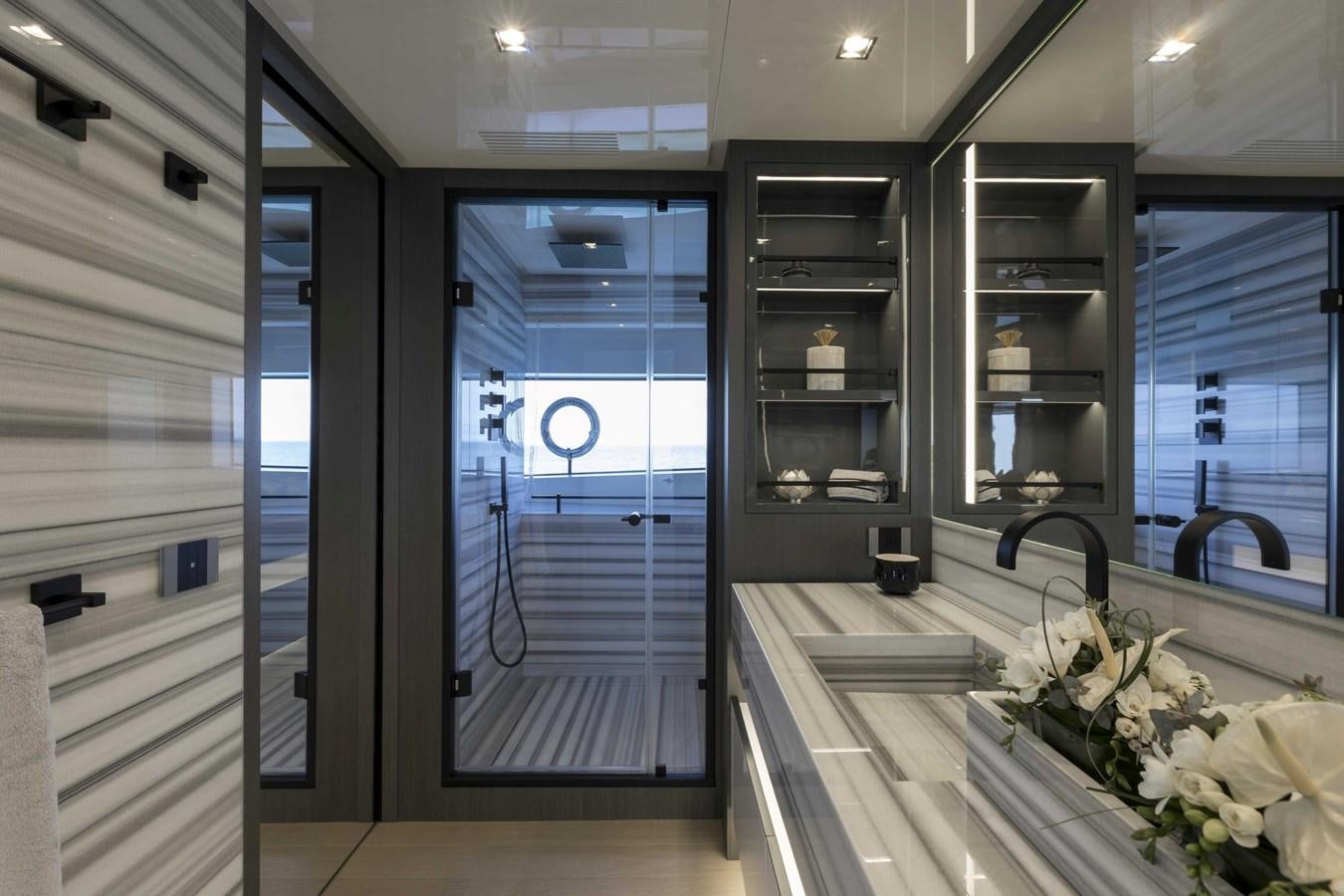 a room with glass doors aboard CRAZY TOO Yacht for Sale