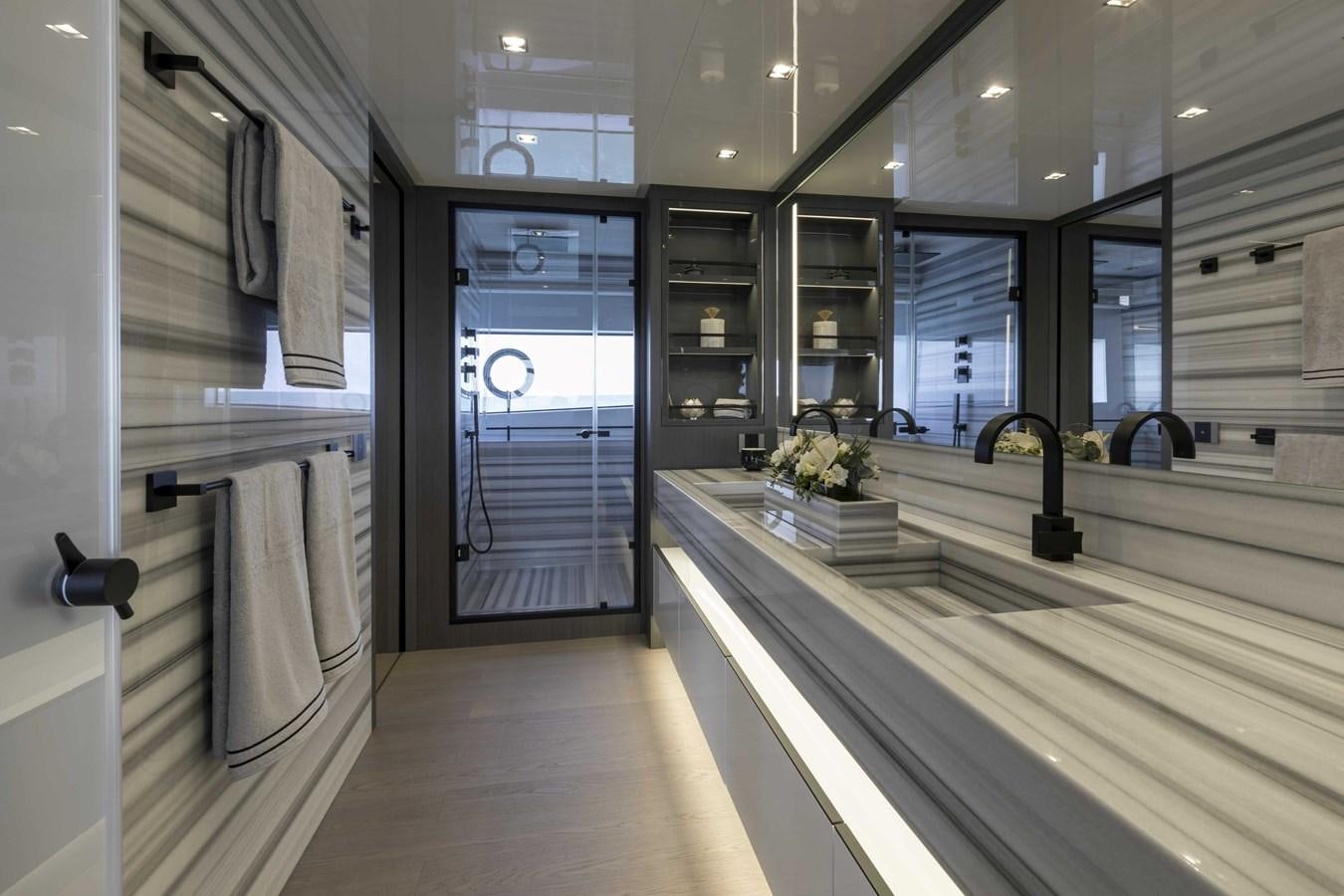 a large kitchen with a large glass door aboard CRAZY TOO Yacht for Sale