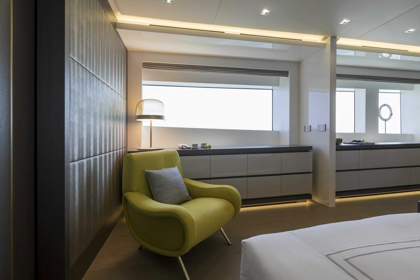 a room with a couch and a window aboard CRAZY TOO Yacht for Sale