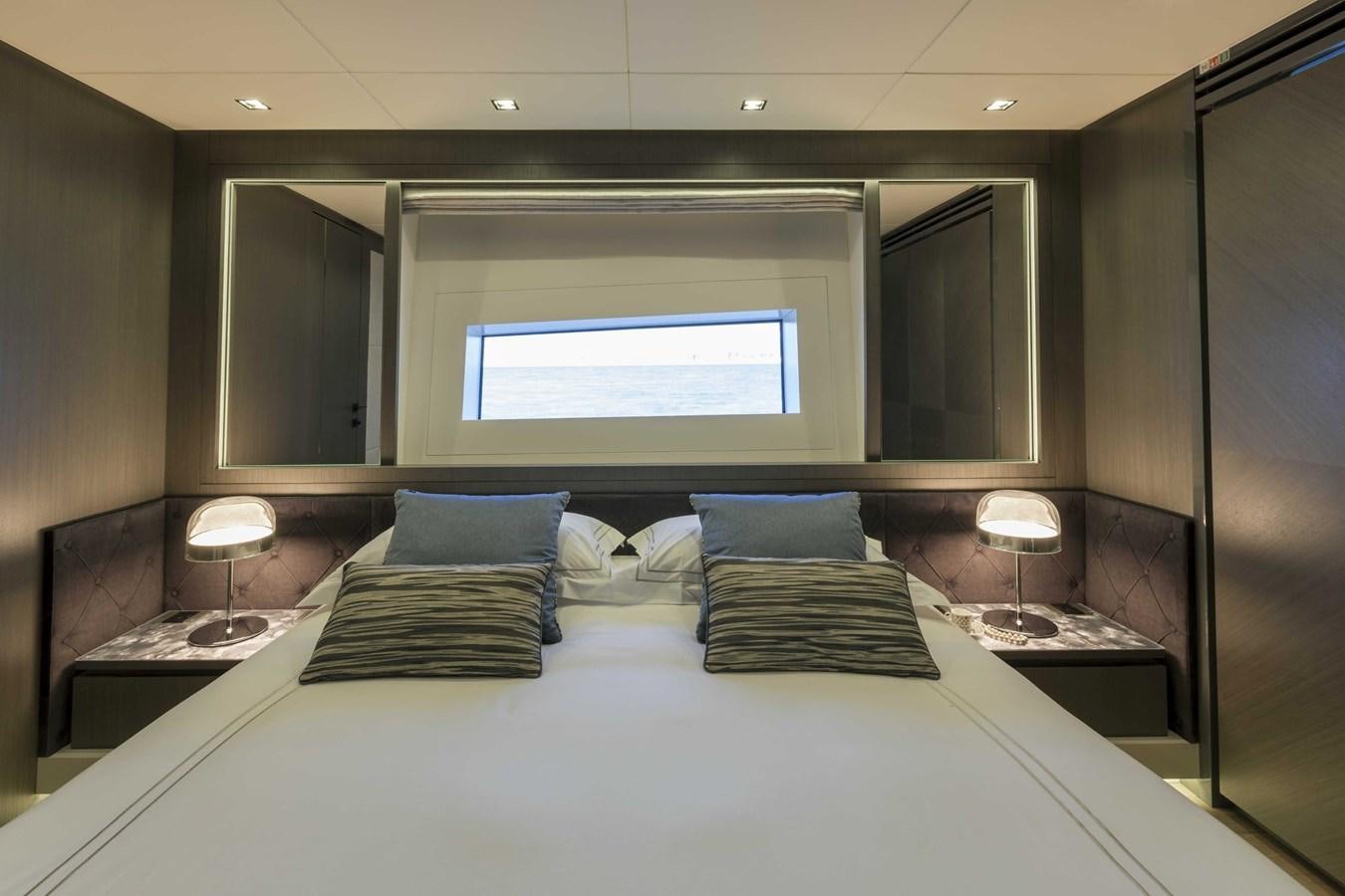 a bed with pillows aboard CRAZY TOO Yacht for Sale