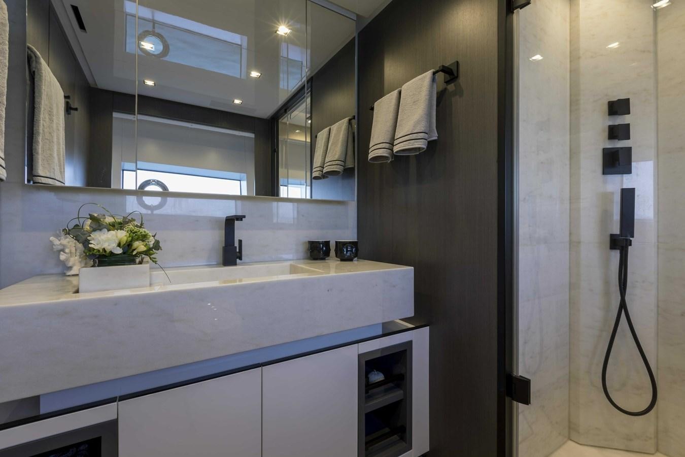 a bathroom with a sink and a mirror aboard CRAZY TOO Yacht for Sale