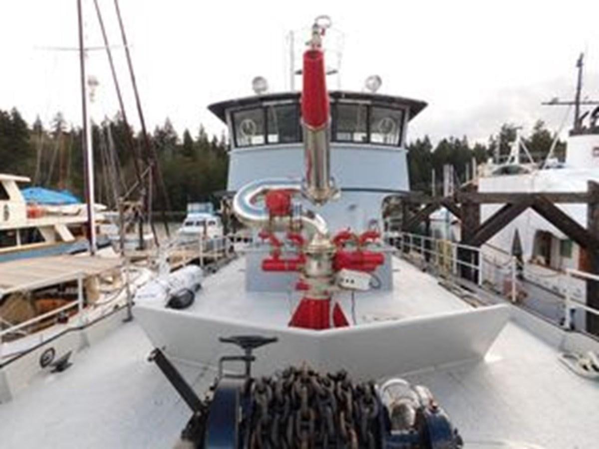 a boat on a water body aboard 1989 COMMERCIAL FIREBOAT Yacht for Sale