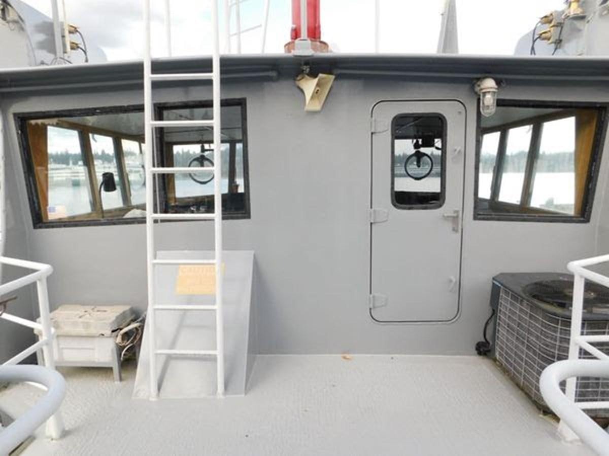 a white room with a ladder and a window aboard 1989 COMMERCIAL FIREBOAT Yacht for Sale