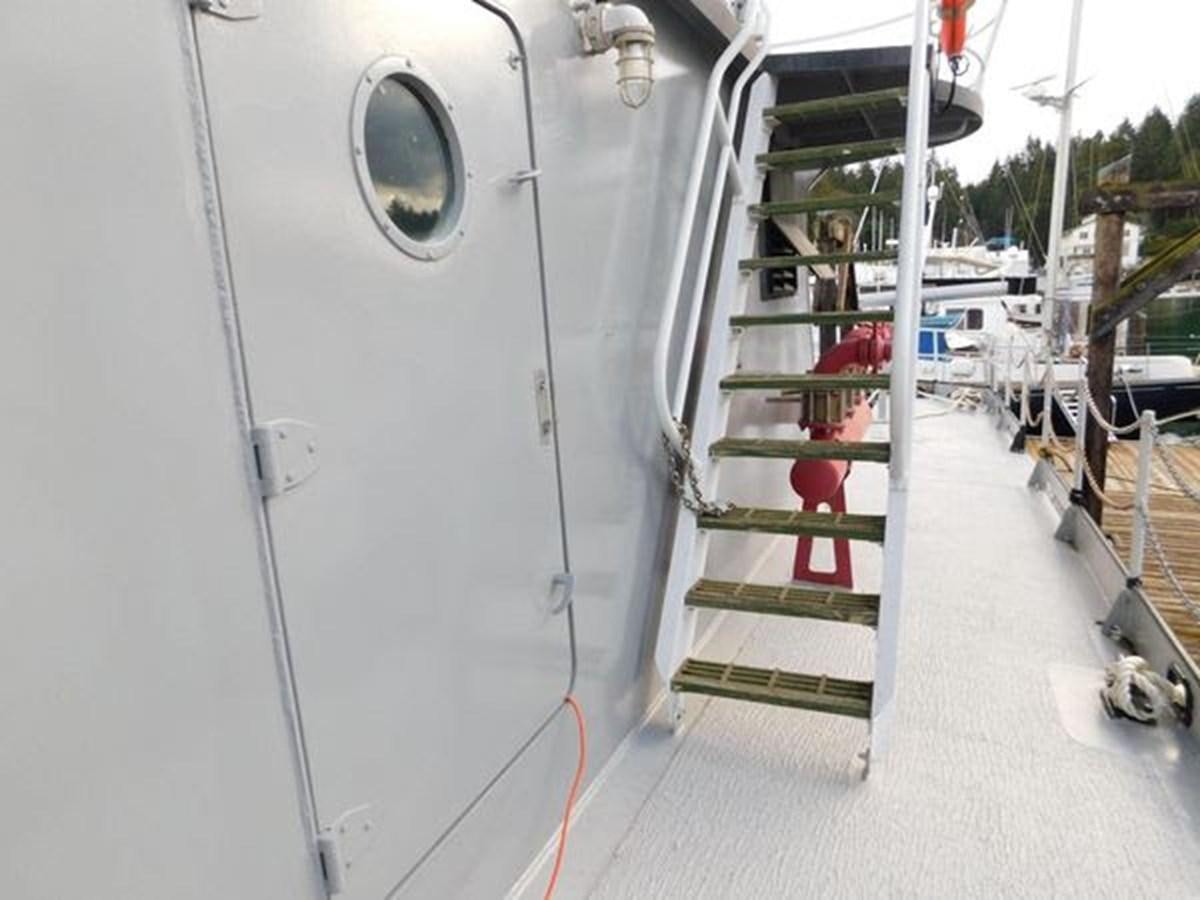 a white machine on a white surface aboard 1989 COMMERCIAL FIREBOAT Yacht for Sale
