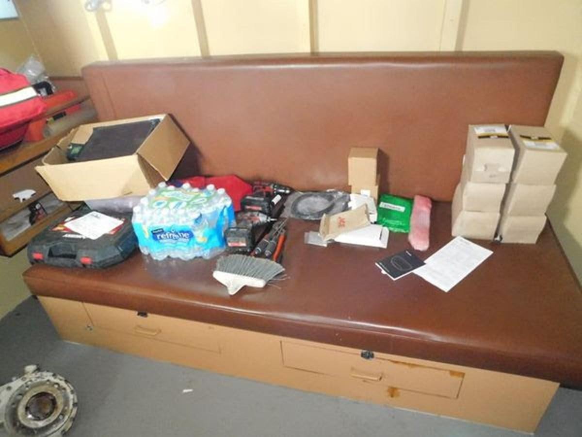 a wooden desk with various items on it aboard 1989 COMMERCIAL FIREBOAT Yacht for Sale