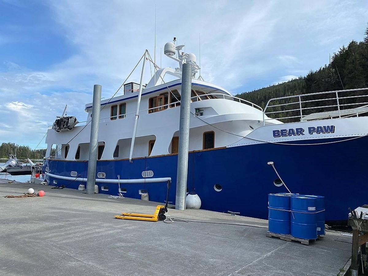a large blue boat aboard BEAR PAW Yacht for Sale